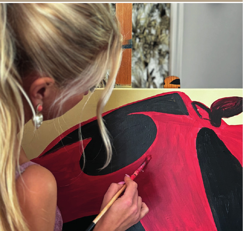Tanja Stadnic painting the Porsche by hand, layer by layer