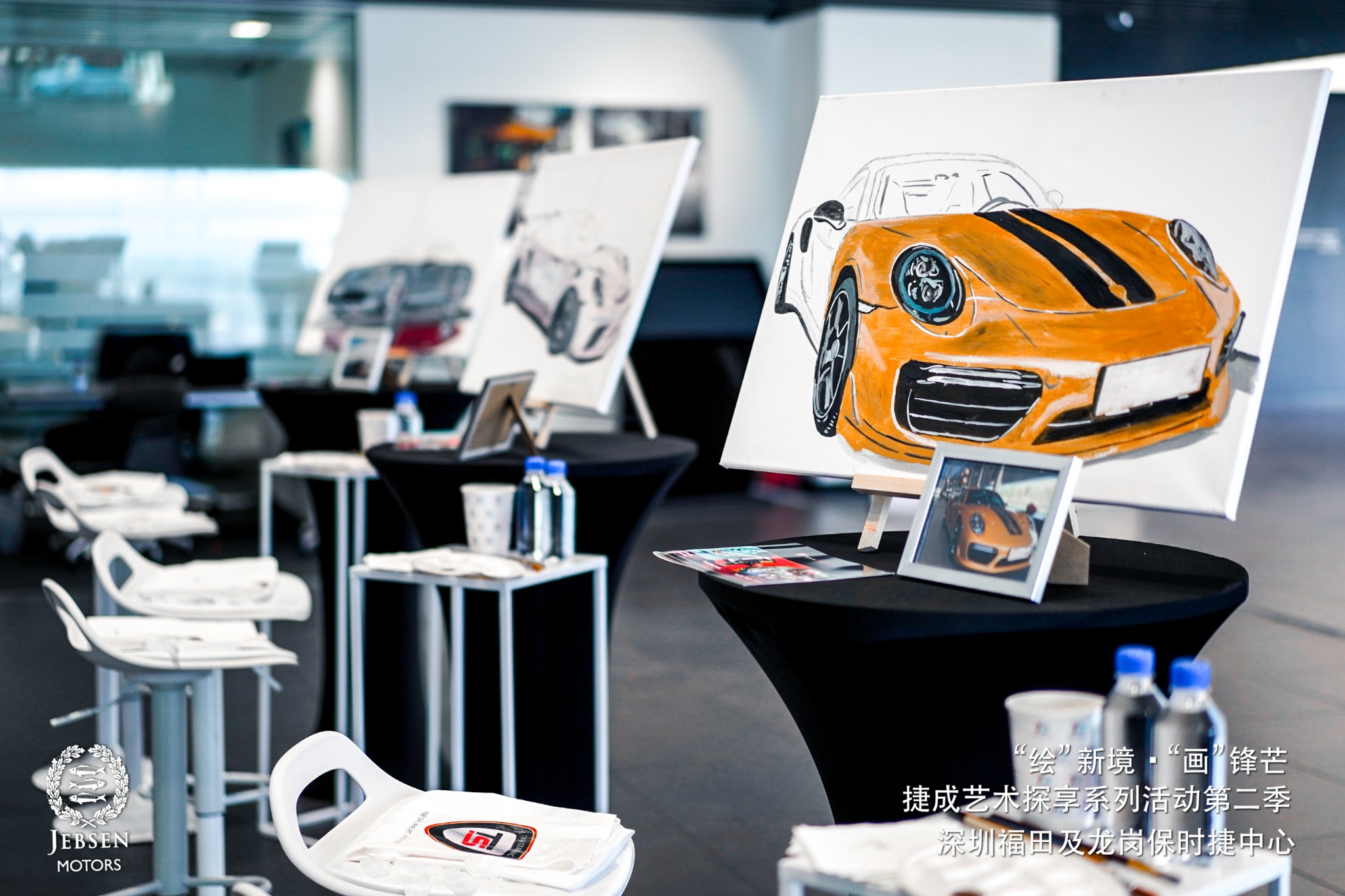 Orange Porsche artwork presented during the Fine Cars event