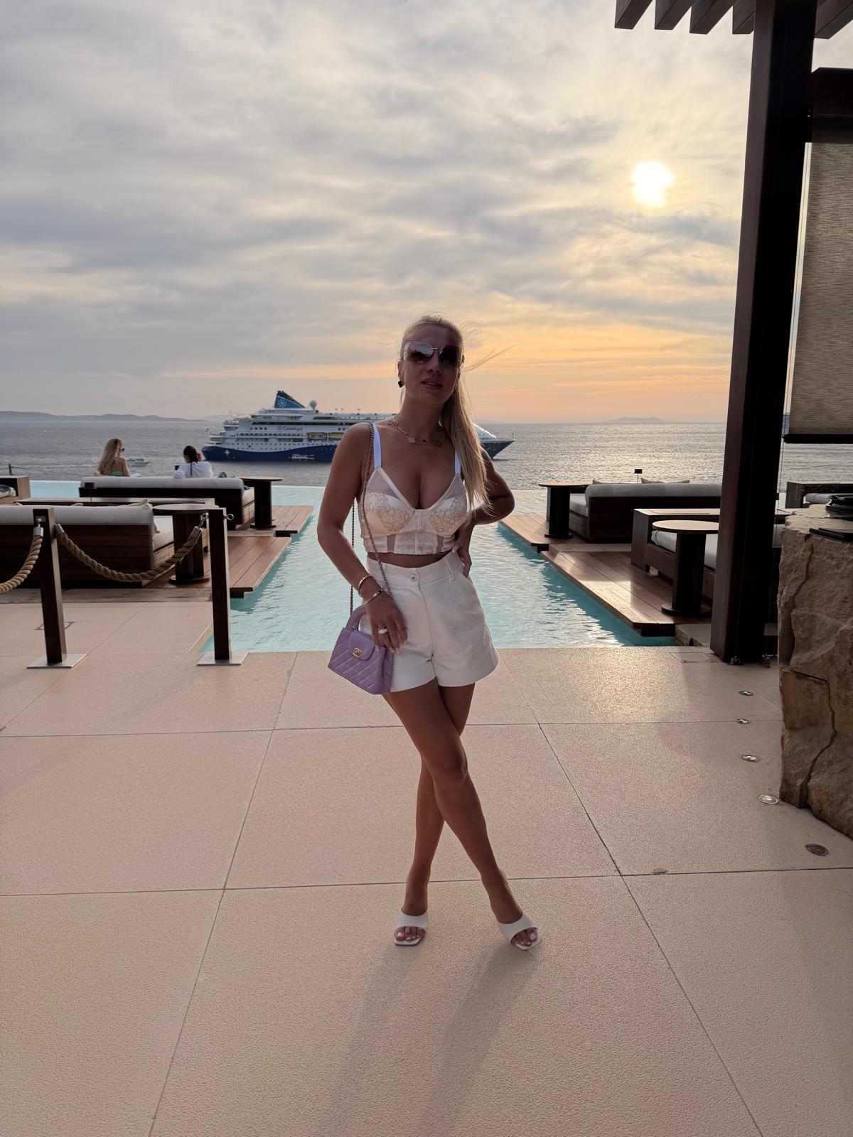 Tanja by the sea at sunset