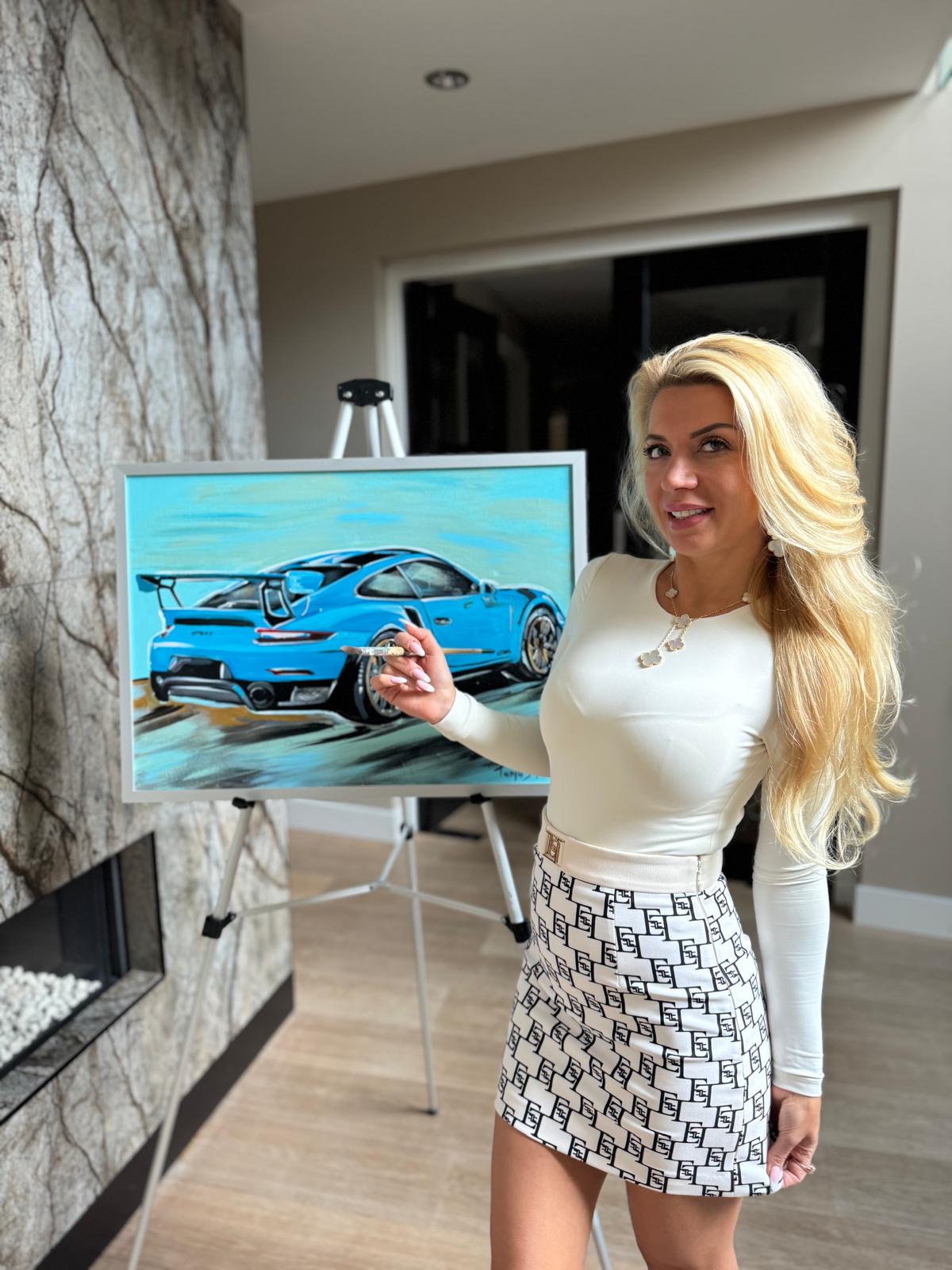 Tanja with a blue Porsche painting
